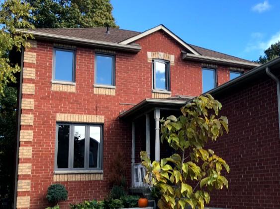 Modern grey window renovation enhancing curb appeal in Midland